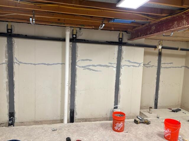Homeowner had multiple horizontal cracks along the foundation walls. We filled them with Nexus Pro and added Carbon Armor straps to support the foundation wall.