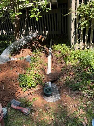 Discharge line installed on the exterior of the property in order to remove the water from the foundation and basement system.
