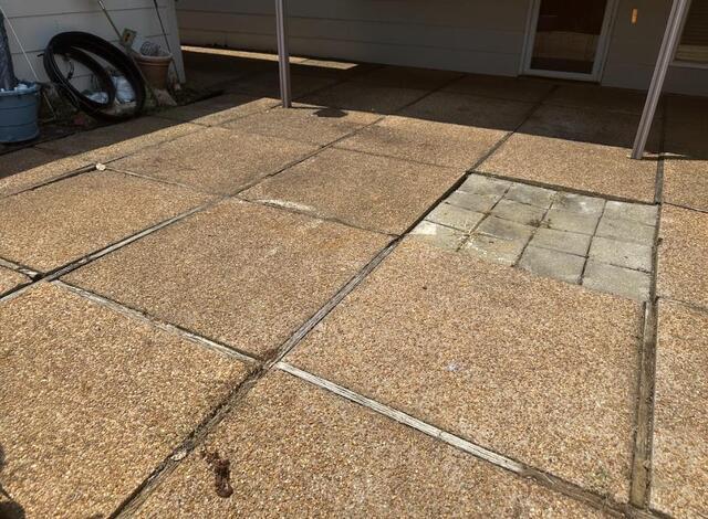 The patio the homeowners called for, notice the large out of place square and displaced joints.