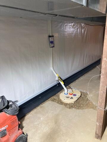 During: Our Design Specialist, Mac, recommended installing waterproofing products throughout the basement.