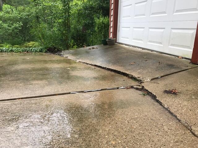 If you look at the edge of the driveway, you can see just how wonky all the slabs had became. The homeowner wasn't even sure if we'd be able to fix it with our foam methods before she had us send an inspector out.