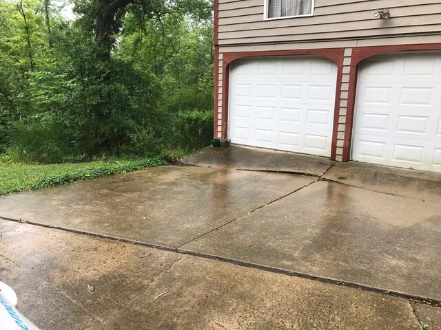 This photo shows the troubling hillside that this driveway was sinking into.