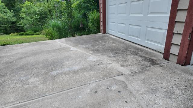 After we leveled the driveway out, we then sealed the cracks with our NexusPro sealant. This sealant is UV-resistant, can stretch, and will prevent water from entering beneath the concrete.