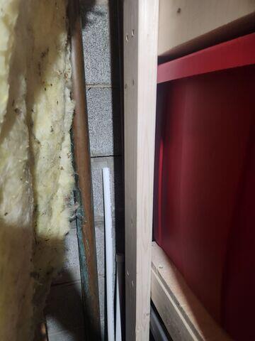 Another photo where cracks can be seen behind the insulation