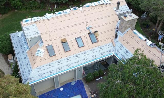 The four skylights on the front slope were upgraded with brand-new Velux skylights. This was part of a full roof replacement, where we installed the complete Klaus Larsen Roofing System. First, SealoronXT Deck Tape was applied between the plywood seams, then VeloraONE Roof Underlayment was rolled out across the roof for extra leak protection, and SealoronXT Ice & Water was placed in all the most vulnerable areas.