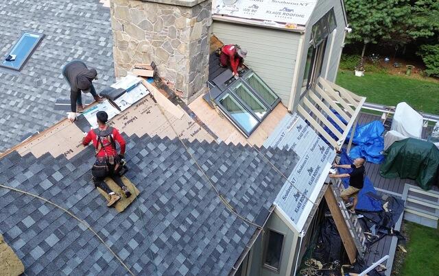 Here's the area after being rebuilt. The old skylight openings were filled in and sealed, then covered with underlayment and new shingles, creating a watertight and durable finish.