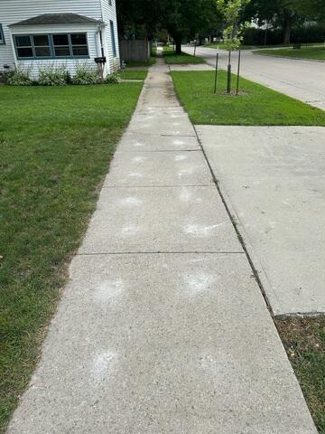 During: Our Foreman, Patrick, and his crew lifted the entire sidewalk in front of the home.