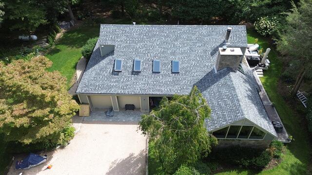 The finished roof from above, complete with IKO Dynasty shingles in Frostone Grey. The home now has a sharp, refreshed look and, most importantly, long-lasting protection. The Klaus Roofing Way!