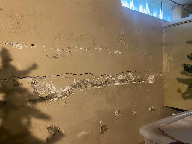 Before: Mac, one of our Design Specialists, recognized the bowing walls and recommended permanently stabilizing them.