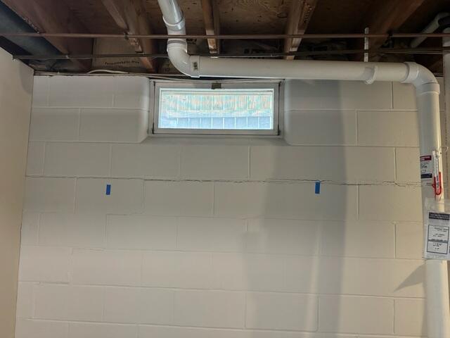Before: Ryan, one of our Design Specialists, recommended installing 12 PowerBraces along the struggling foundation.