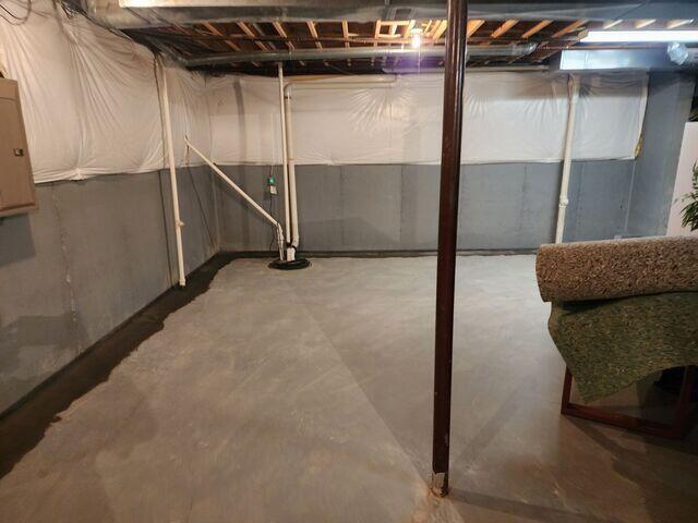 This photo was taken by our foreman after the job was completed. You can see that our WaterGuard drains are tied into all of the radon suction points, including the two pipes running straight out of the floor slab and into the ceiling.