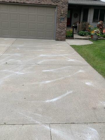 During: Our Foreman, Ryan, and his crew successfully lifted and leveled the driveway back to its original position.