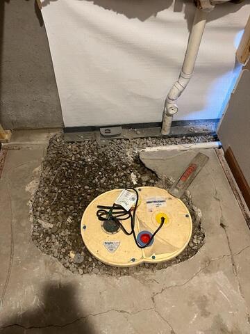 During: Our Foreman, Kingsley, and his crew worked hard to secure all the waterproofing products throughout the basement.