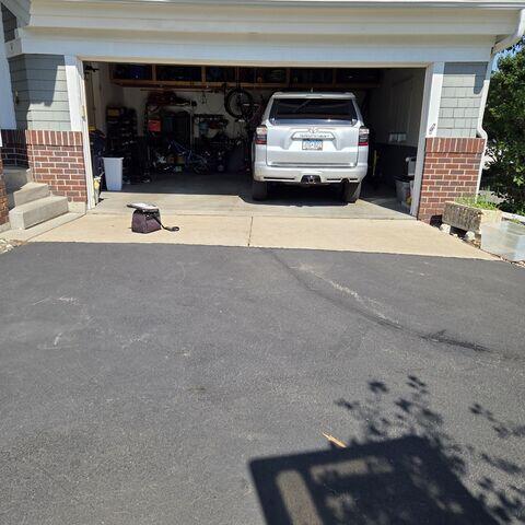 Before: A look of the slabs sinking in front of the garage
