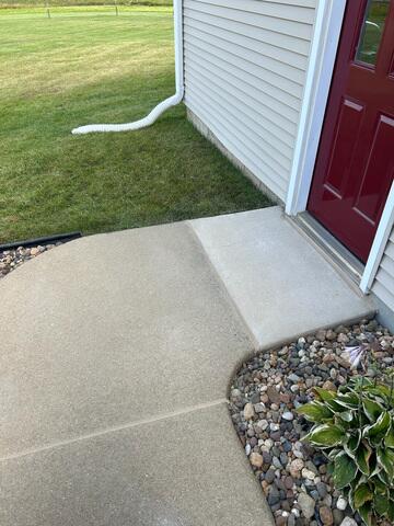 After: Our Foreman, Ryan, and his crew successfully lifted and leveled the sidewalk back into place.