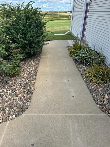 During: Our Design Specialist, Ryan, traveled to the home to take a closer look at the sunken sidewalk.