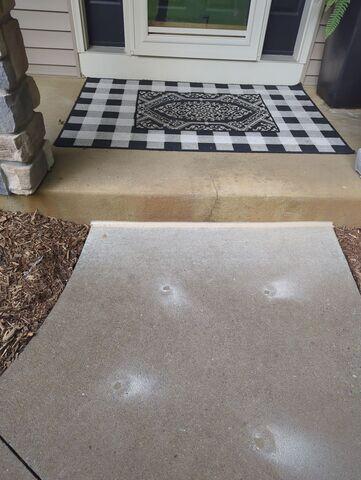 After: Our crew lifted the slabs along the walkway and sealed the joints