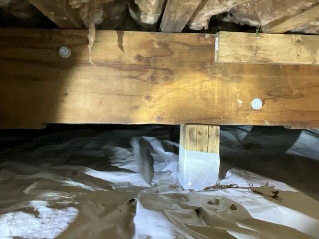 Insufficient support on the beams caused the floor in the home to bow.