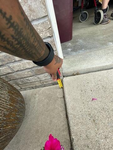 A close look at how far the slabs in front of the garage had begun sinking