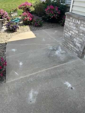 The slabs along the walkway were lifted and the joints and crack were sealed