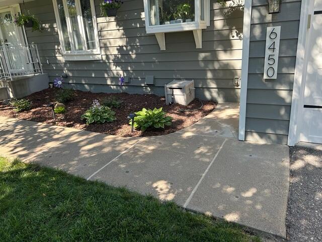 After our crew lifted and leveled the slabs, sealed the joints, and repaired the cracks