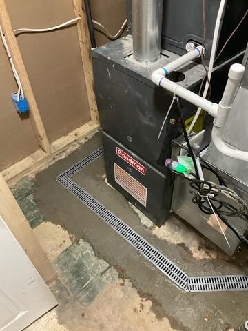 Placed at key entry points like stairwells and doorways, our TrenchDrain System captures surface water before it can enter the basement, providing critical protection against above-floor water intrusion.