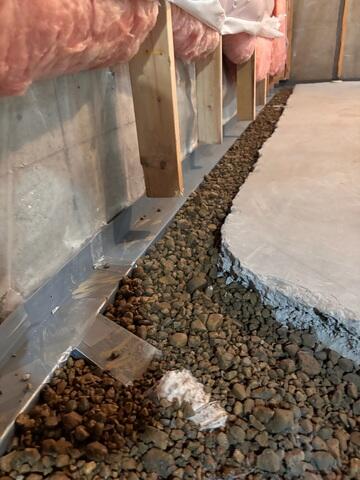 Our crew in the process of installing WaterGuard at the perimeter