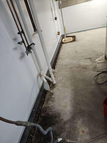 Our crew in the process of installing SuperSump+, WaterGuard, and CleanSpace