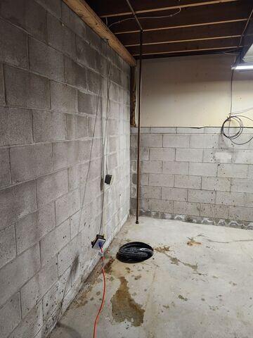 Before the space is waterproofed. Efflorescence and water stains can be seen