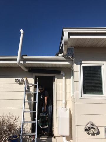 The radon mitigation system installed outside of the home