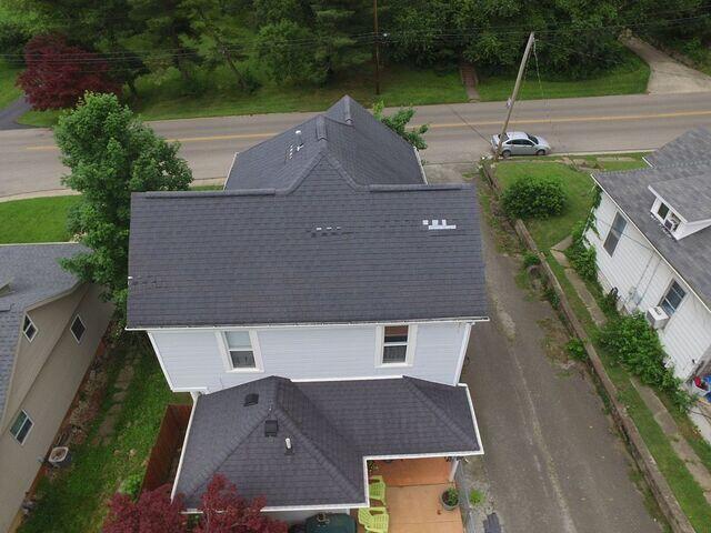 This photo was taken upon the initial inspection and it reveals many missing shingles.