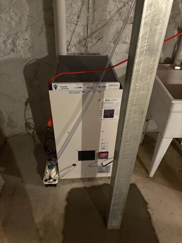 The SaniDry XP dehumidifier keeps the humidity in the air of the basement low and conveniently drains itself.
