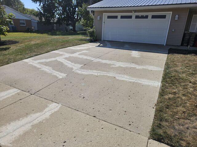 This photo was taken after we sealed the driveway cracks with our SealantPro. We used a matching color sand to blend the sealant into the existing color of the concrete. We had to use more sand than normal to erase the mismatching color of the old sealant, but it was well worth it.