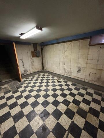 WaterGuard perimeter drainage system installed and concealed under fresh concrete, directing water safely to the SuperSump and keeping the basement dry.