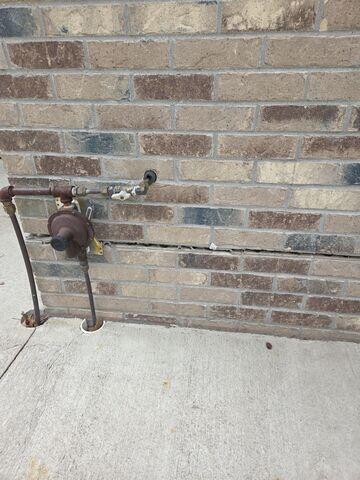 Before: The homeowner noticed their exterior walls were beginning to crack and separate.