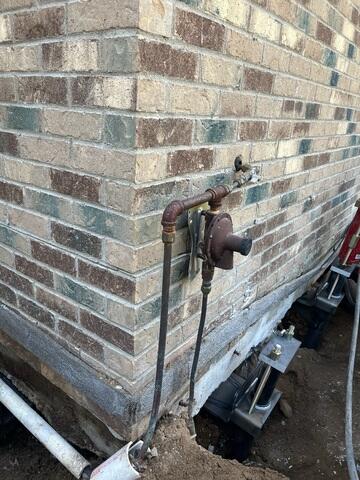 After: Our Foreman, Kingsley, and his crew successfully secured the Push Piers along the struggling walls.