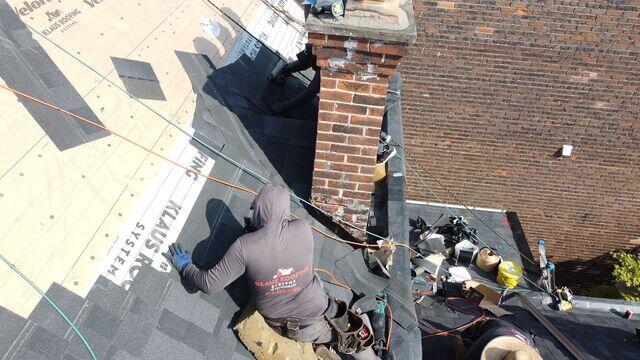 This photo gives a close up view of the shingle installation. These shingles are class 3 rated against wind & hail, partly due to their enhanced nailing zone called the ArmourZone. This thicker nailing zone ensures our galvanized nails are securely fastened, and it prevents ripping. These shingles are also infused with copper to prevent algae growth.