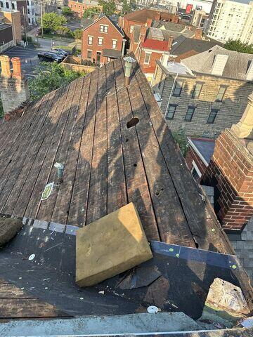 This was what the decking looked like underneath the two layers of shingles. This was after we stripped the shingles off. You can see the large gaps in the decking system that created a risk for leaks and premature shingle failure.