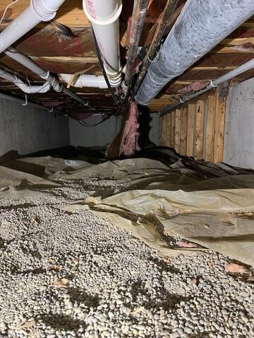 This was what the crawl space looked like before we started the project. The floor joists were sinking to the right side of this picture.