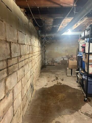Before: Our Design Specialist, Dylan, recommended waterproofing the entire space.