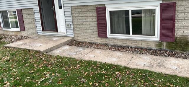 During: Our Foreman, Patrick, and his crew lifted the sunken slabs and walkway in front of the home.
