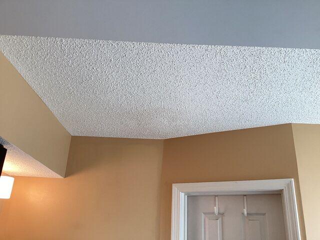 The water stain was repaired and texture-matched perfectly.