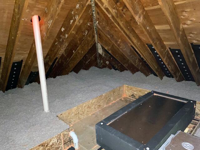 After completing the attic air sealing and insulation, we installed the David Lewis Hatch Cover over the entrance to provide extra insulation and a tighter seal.