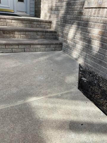 During: Our Foreman, Charlie, and his crew successfully lifted and leveled the sidewalk back to its original position.