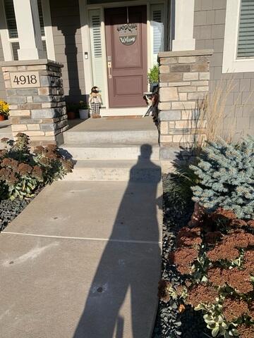 After our crew lifted the slabs and sealed the joints of the sidewalk