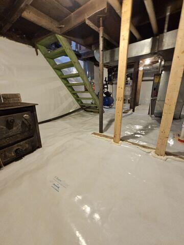 Drainage Matting: Placed beneath the CleanSpace liner to help channel water toward the sump pump, preventing seepage beneath the liner from becoming a problem. CleanSpace® Crawl Space Encapsulation System: A durable, 20-mil vapor barrier was installed over the entire crawl space floor and walls. This bright white liner completely seals out ground moisture, creates a clean, finished look, and channels any seepage toward the sump system.