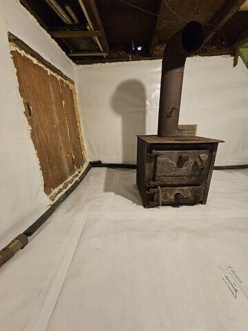 Drainage Matting: Placed beneath the CleanSpace liner to help channel water toward the sump pump, preventing seepage beneath the liner from becoming a problem.CleanSpace® Crawl Space Encapsulation System: A durable, 20-mil vapor barrier was installed over the entire crawl space floor and walls. This bright white liner completely seals out ground moisture, creates a clean, finished look, and channels any seepage toward the sump system.