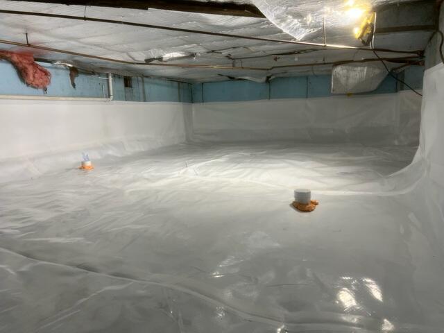 Drainage Matting: Placed beneath the CleanSpace liner, this allows any water beneath the barrier to flow easily toward the SmartDrain for removal. CleanSpace® Encapsulation System: A heavy-duty, 20-mil reinforced vapor barrier was installed over the entire crawl space floor and walls. This durable liner completely seals out moisture from the earth, preventing humidity, odors, and vapor from entering the home. It also brightens the space, making it easier to access for future maintenance.