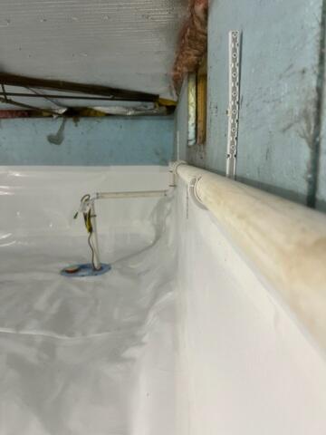 CleanSpace® Encapsulation System: A heavy-duty, 20-mil reinforced vapor barrier was installed over the entire crawl space floor and walls. This durable liner completely seals out moisture from the earth, preventing humidity, odors, and vapor from entering the home. It also brightens the space, making it easier to access for future maintenance.

SmartDrain® System: Explicitly designed for encapsulated crawl spaces, the SmartDrain was installed beneath the CleanSpace liner to collect and remove any water that might enter from plumbing leaks or unexpected seepage. It features an airtight lid and a WaterWatch® alarm that notifies the homeowner if water is ever detected.

Drainage Matting: Placed beneath the CleanSpace liner, this allows any water beneath the barrier to flow easily toward the SmartDrain for removal.