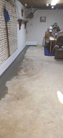 The homeowner had wasted a lot of time, energy, and money trying to keep their fireplace dry. Their latest leak was the last straw, so they contacted us for a permanent fix. The hearth had to be removed in order for us to install our system, but the homeowner was more than willing to do what was necessary to stop the issue once and for all. Along the base of the wall you can see where we installed our WaterGuard drainage system, concealed beneath the floor. Our WaterGuard drains come with wall flanges that allow moisture to seep down from the walls and into the drainage system.